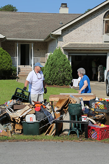 A Knight of Columbus, from St. Paul Church in New Bern, assists Nancy Sciara following Hurricane Florence.