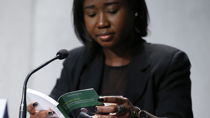 Laphidil Oppong Twumasi, a youth leader from Ghana, reads Pope Francis' apostolic exhortation, "Christus Vivit" (Christ Lives), during a news conference for its presentation at the Vatican April 2, 2019. The document contains the pope's reflections on the 2018 Synod of Bishops on young people, the faith and vocational discernment. (CNS photo/CNS photo/Paul Haring)