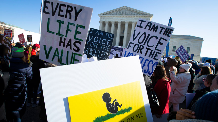 Pro-life advocates are seen near the U.S. Supreme Court Dec. 1, 2021, the day justices heard oral arguments in a case about a Mississippi law that bans abortions after 15 weeks of gestation. (CNS photo/Tyler Orsburn)