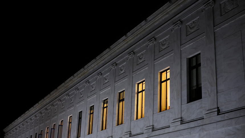 Lights burn inside U.S. Supreme Court offices in Washington May 2, 2022, after the leak of a draft majority opinion written by Justice Samuel Alito preparing for a majority of the court to overturn the landmark Roe v. Wade abortion rights decision later this year. (CNS photo/Jonathan Ernst, Reuters)