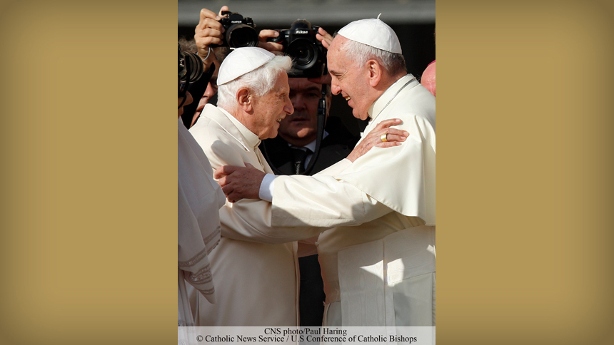 Pope Francis greets retired Pope Benedict XVI during an encounter for the elderly in St. Peter's Square at the Vatican Sept. 28, 2014. (CNS photo/Paul Haring)