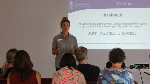 Emilie Hart, of Catholic Charities Cape Fear Office, trains canvassers at a Sept. 28 meeting in Wilmington.