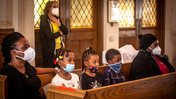 A family attends Mass at St. Barbara Catholic Church in Philadelphia Feb. 6, 2022. (CNS photo/Chaz Muth)