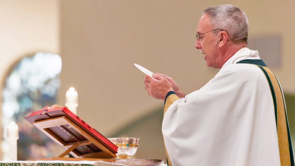 Bishop Zarama with the Holy Eucharist